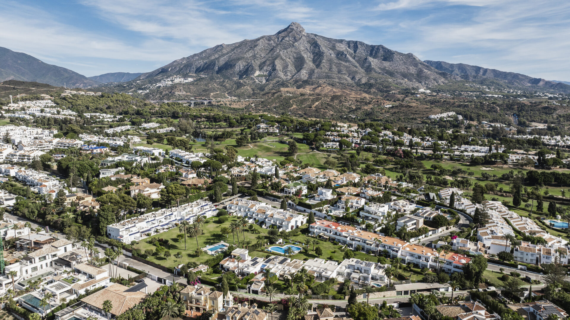 Panoramic view of Nueva Andalucía with La Concha mountain and golf valley homes, Marbella