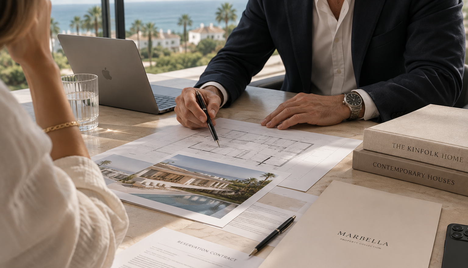 Lawyer reviewing property documents and floor plans for a luxury home purchase in Marbella
